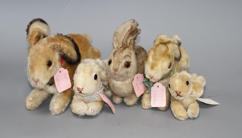 Two 1950s Steiff Hoppy rabbits, 23cm and 18cm, a 1940s Pummy rabbit, 15cm, and two lying rabbits, 20cm and 15cm